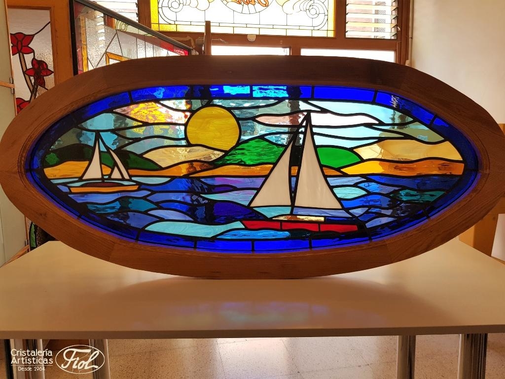 Stained glass window for private housing with seascape combining different shades and textures of blues.